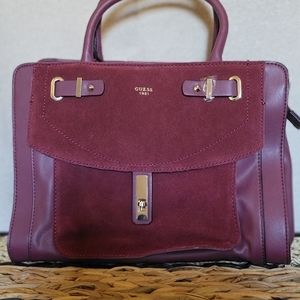 GUESS HANDBAG never been use, front pocket material is suede and rest is leather